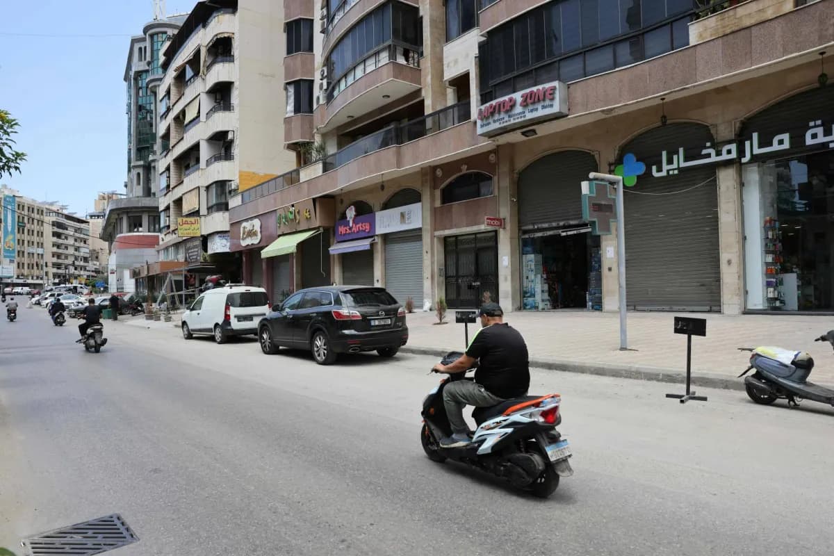Returnees to Beirut suburbs wary of renewed conflict
