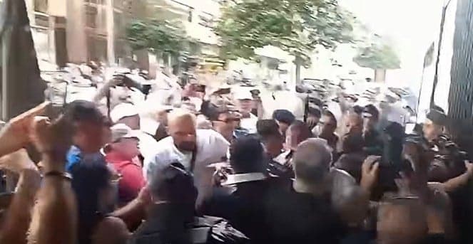Former minister attacked amid clashes