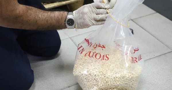 Asian man caught with 22 drug capsules