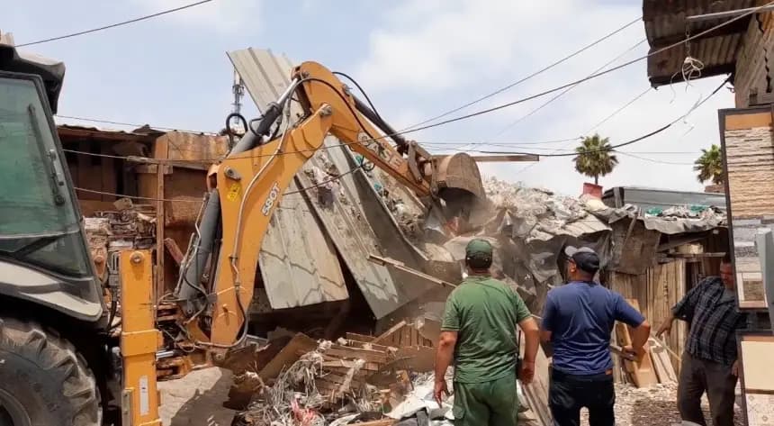 Qara'a public property cleanup bulldozers demolish shops