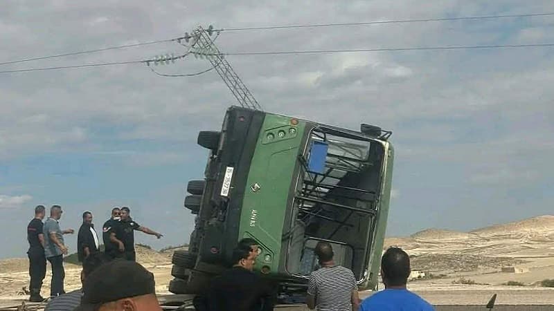 Bus overturns leaving one dead and injured