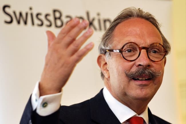 Swiss banker given two-year suspension