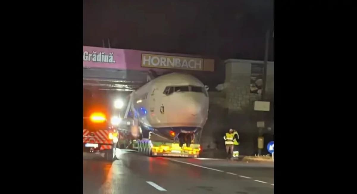 Passenger plane trapped under bridge
