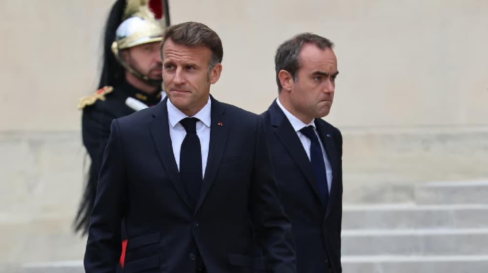 Macron vows tough measures amid union talks