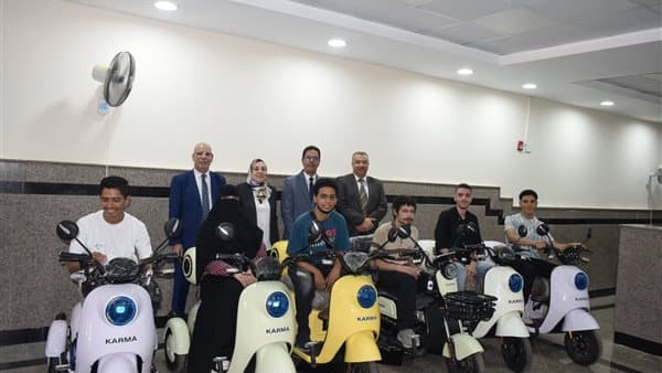 Benha University President Gives Scooters to Disabled