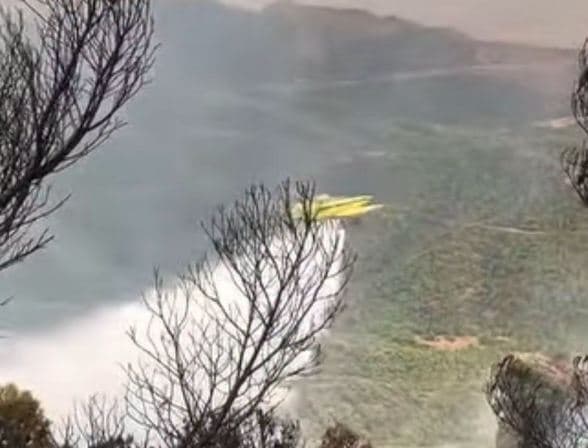 Helicopters battle fires across three states