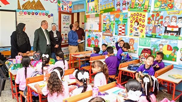 Port Said Education Director oversees studies and assists students in reading and writing