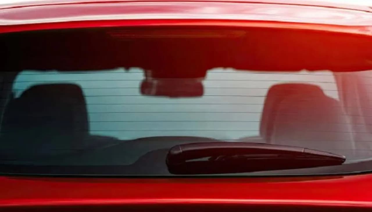 Hidden behind the rear window defroster lines
