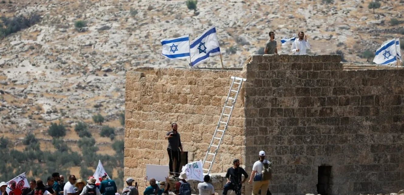 Britain Warns on Israeli Settlements