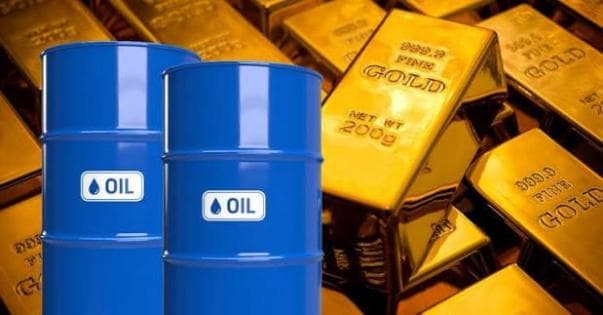 Oil drops as gold rises