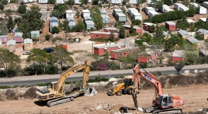 Zionist bulldozers build settler road west of Ramallah
