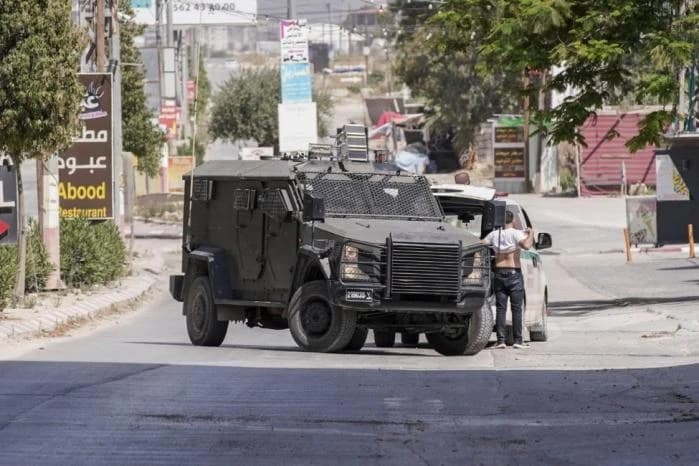 Israeli forces storm Dura al-Qur'a and settlers raid al-Mughayir