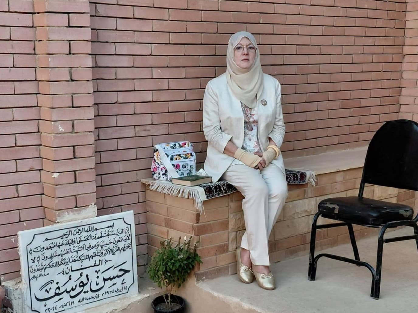 Shams Al-Baroudi mourns at gravesite