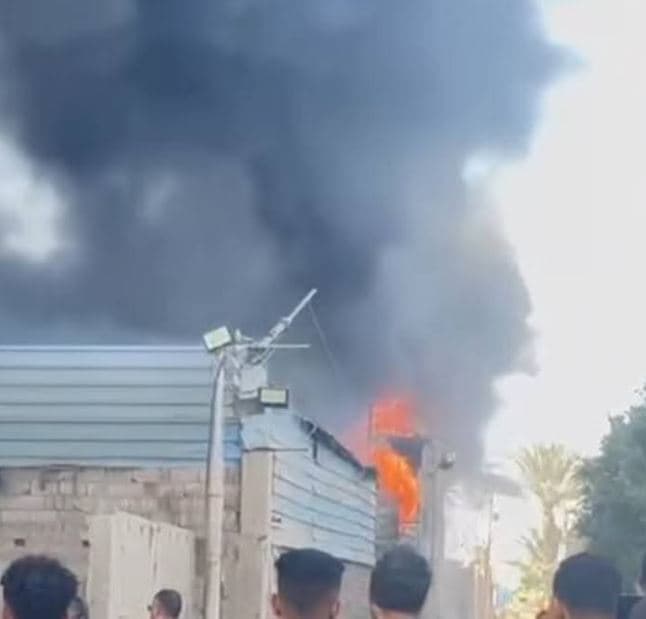 Fire containment at Kerdasa warehouse