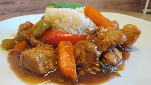 Preparing Chinese chicken with soy sauce and vegetables
