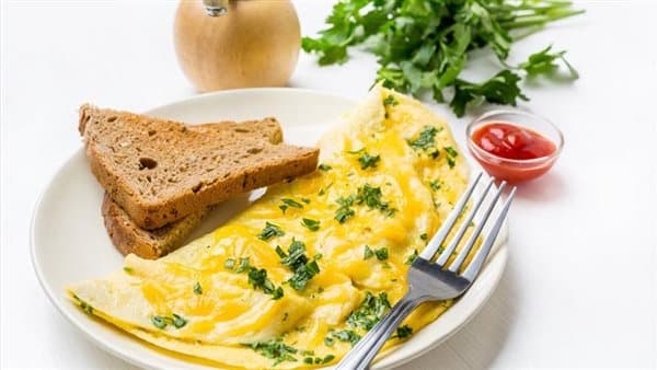 Making mozzarella omelet for kids breakfast