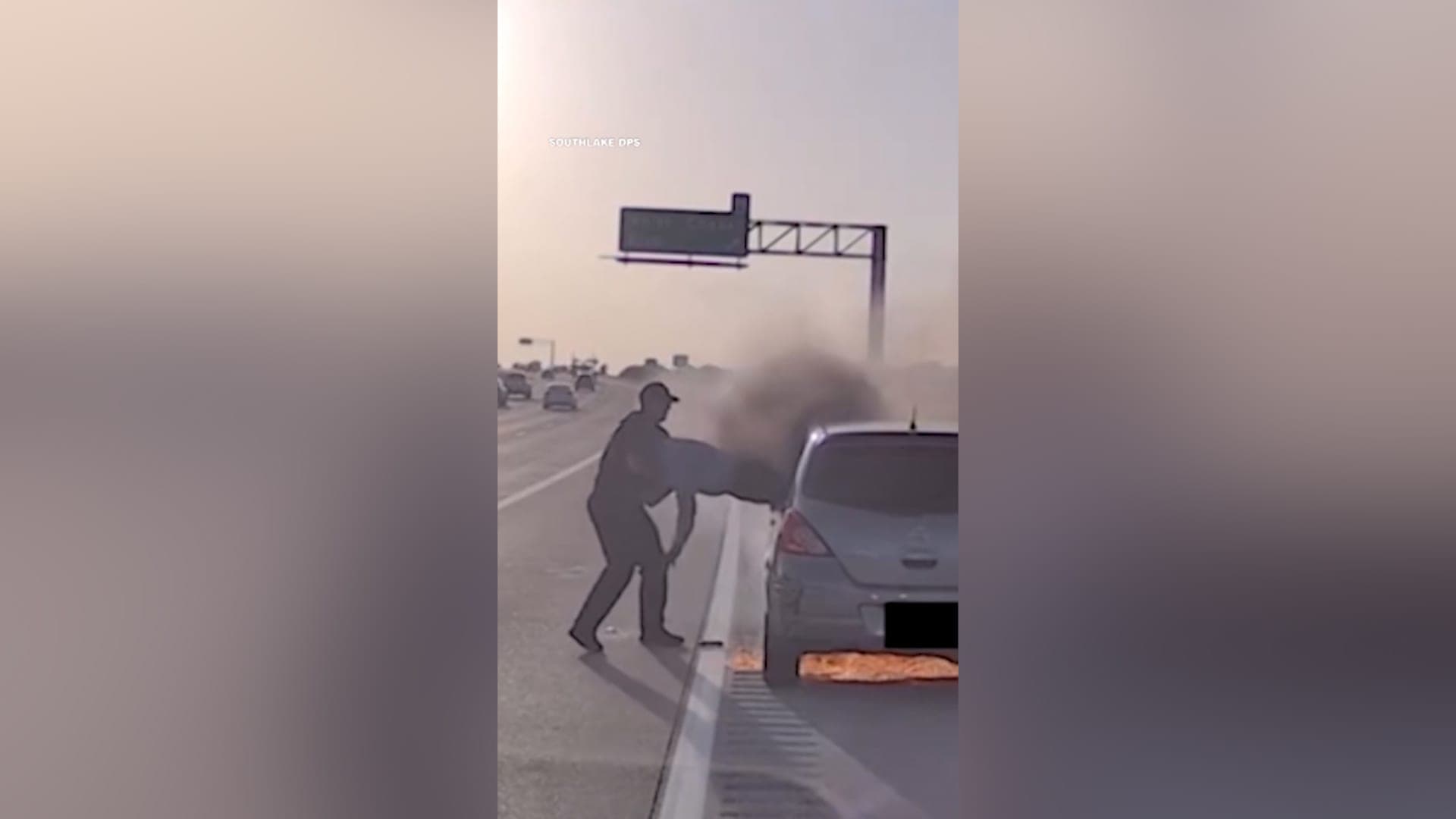 Officer rescues man from burning car