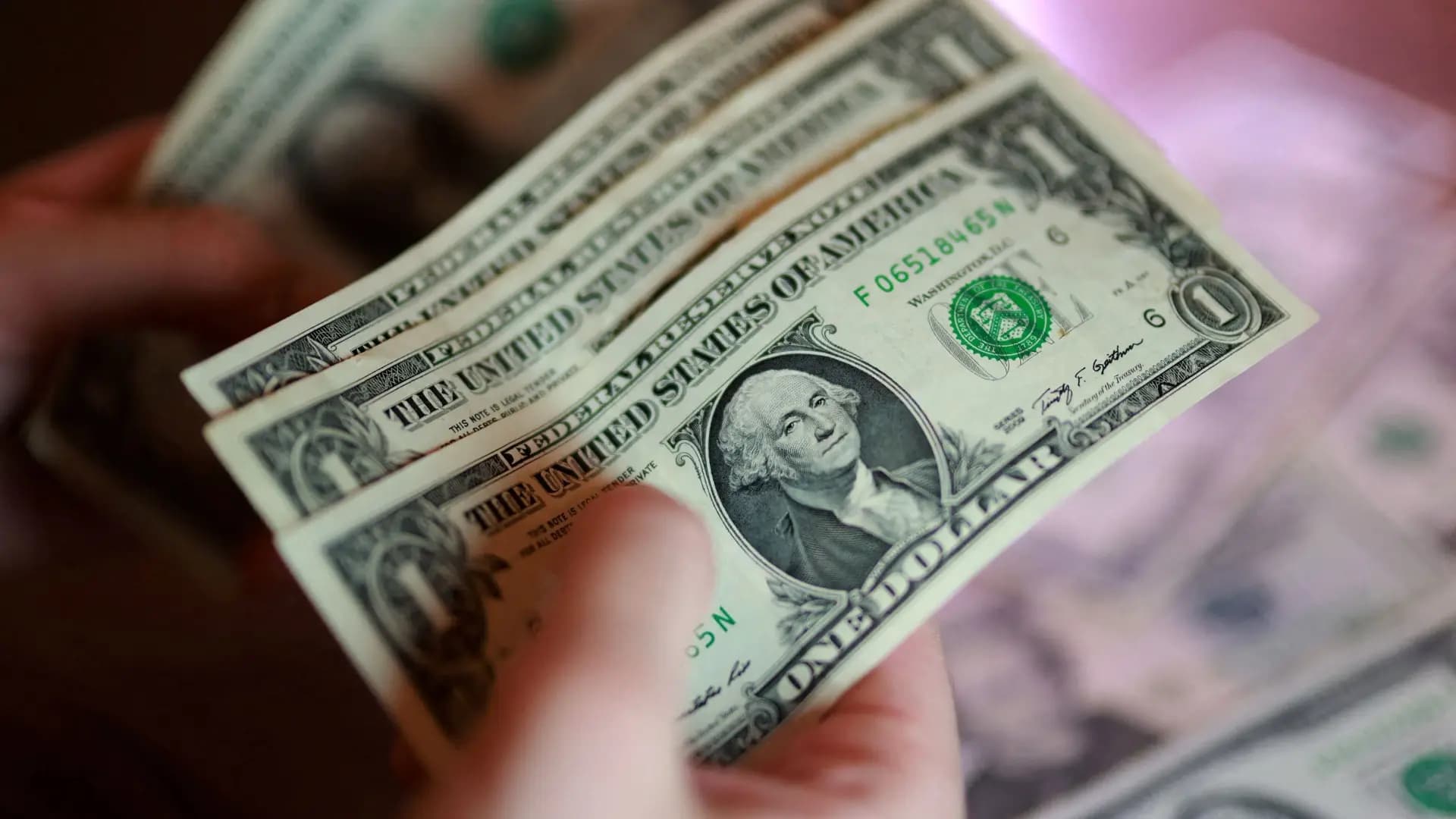 Dollar climbs towards weekly high