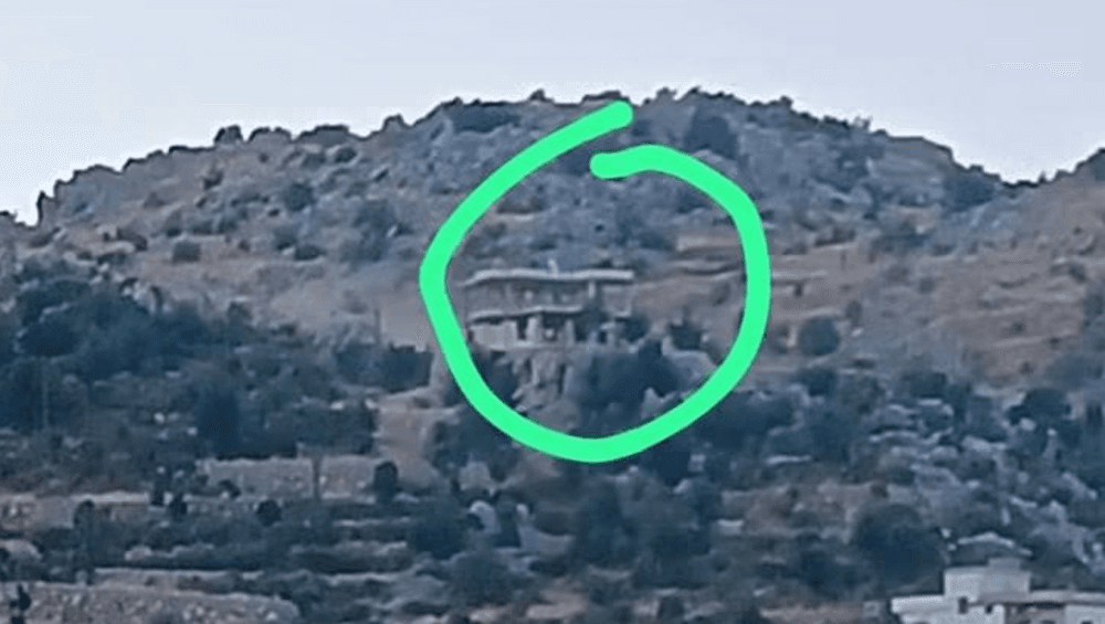 Israeli forces wave flag east of Kfar Shuba