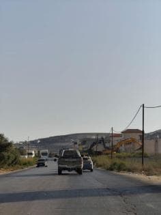 Occupation forces demolish warehouses at Azza entrance